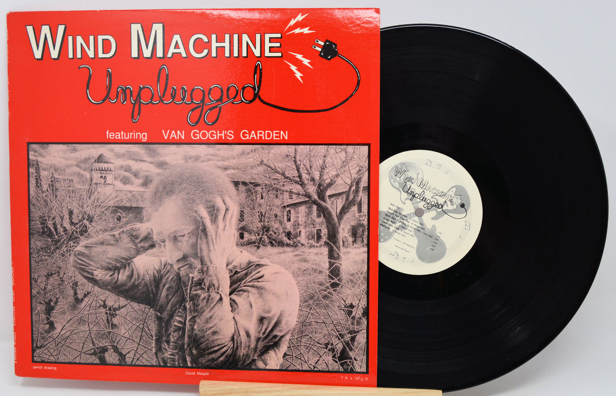 Vinyl record with red cover featuring artistic design and text