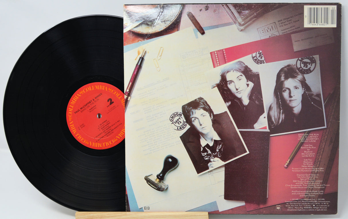 Vinyl record with a colorful album cover featuring images of a person.