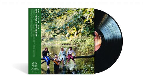 Vinyl record with a scenic cover featuring people by a lake.