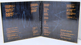 Open book with text and blue wave graphics on a black background