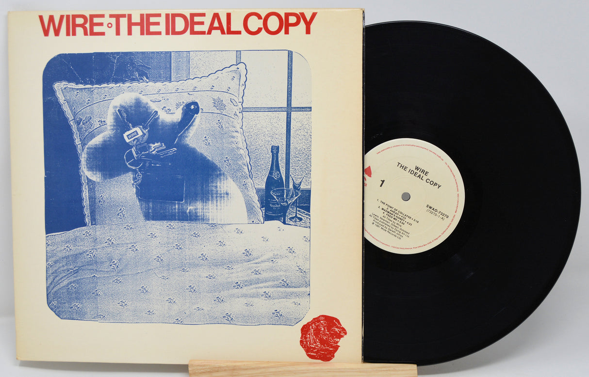 Vinyl record and cover titled 'The Ideal Copy' by Wire on a white background