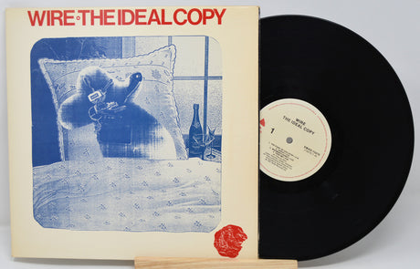 Vinyl record and cover titled 'The Ideal Copy' by Wire on a white background