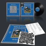 Vinyl record set with blue cover, black record, and photo insert on a reflective surface.