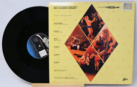 Vinyl record with its cover displaying album artwork and text.