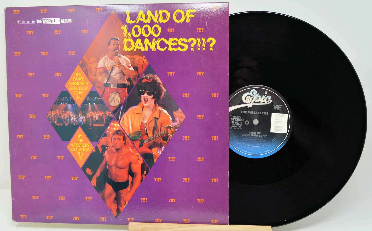 Vinyl record with colorful cover featuring text 'Land of 1,000 Dances?!!?' and a record label.