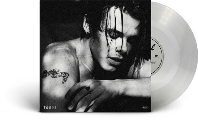 Vinyl record with a black and white cover featuring a person with a tattoo.