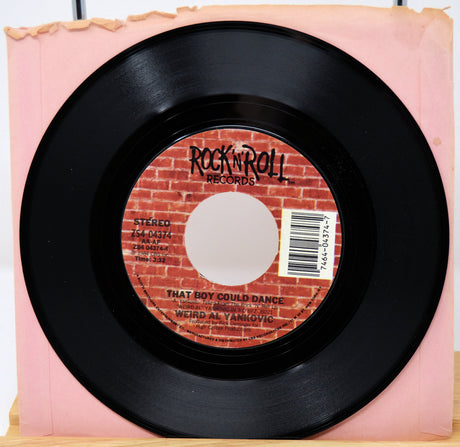 Black vinyl record with a red label featuring 'Rock 'n' Roll Records' on a pink background