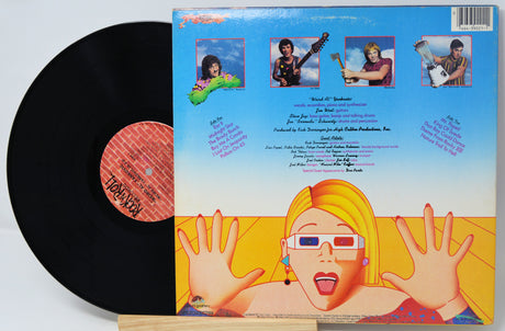 Vinyl record with colorful cover featuring a person with glasses and outstretched hands.