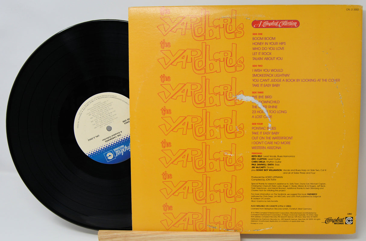 Vinyl record with yellow back cover featuring text and logo containing song titles from Yardbirds A Compleat Collection