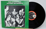 Vinyl record with green cover featuring a band and 'Chances of Things' text.
