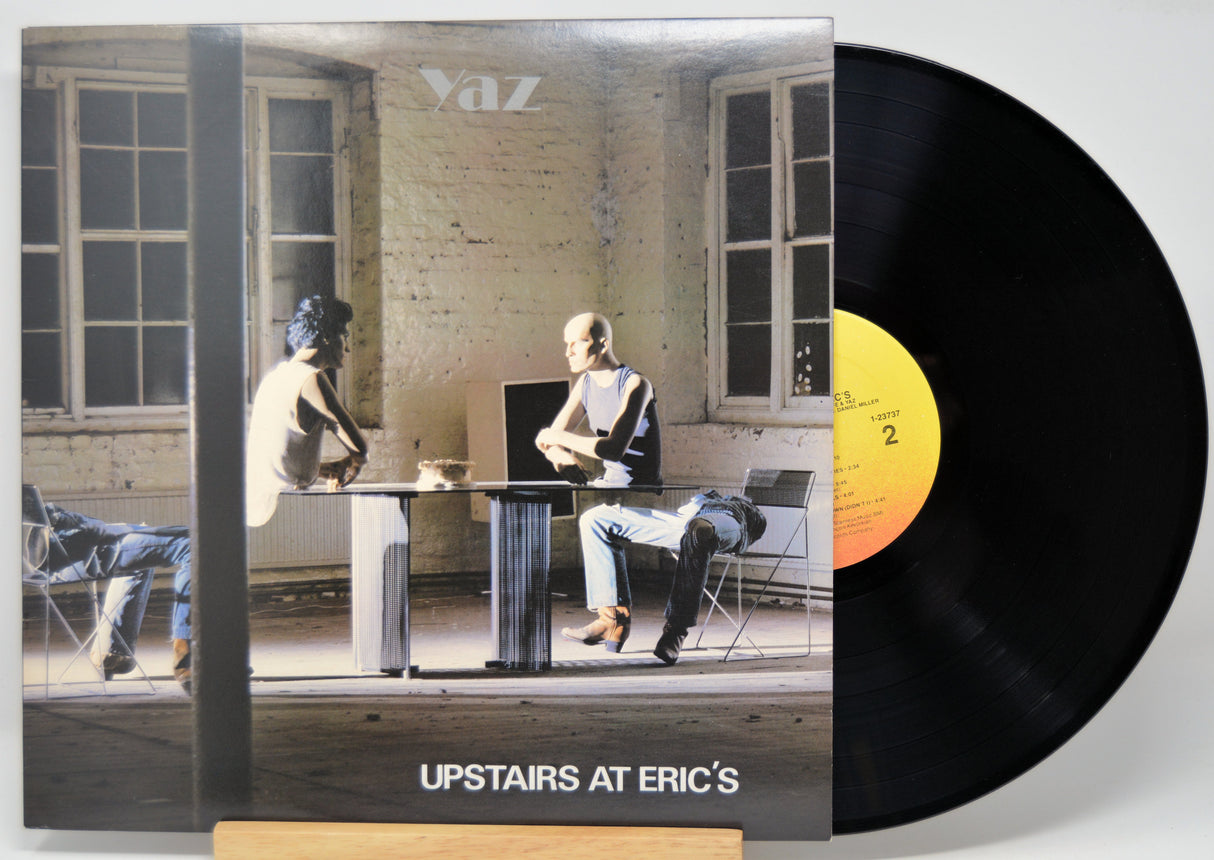 Vinyl record with cover showing a scene of people in a room, titled 'Upstairs at Eric's'.
