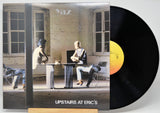 Vinyl record with cover showing a scene of people in a room, titled 'Upstairs at Eric's'.