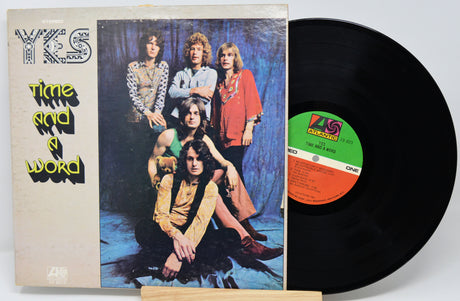 YCS album cover and vinyl record with band members on the cover