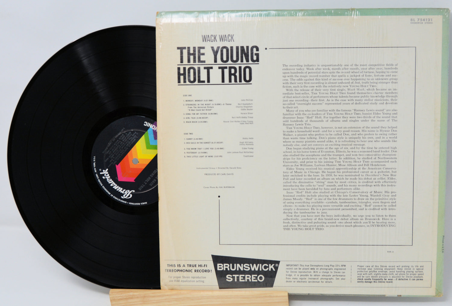 Vinyl record with cover featuring 'The Young Holt Trio' on a light gray background