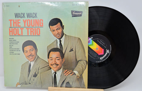 Vinyl record and cover of 'Wack Wack' by The Young Holt Trio with a white background