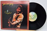 Vinyl record with cover featuring a person and album title 'Songbird' by Jesse Colin Young.