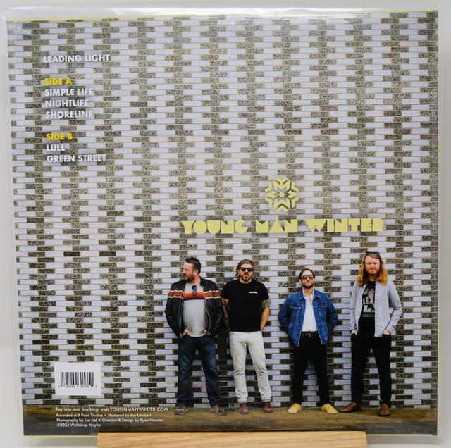 Back cover of Young Man Winter Leading Light vinyl album with band members posed against a brick wall
