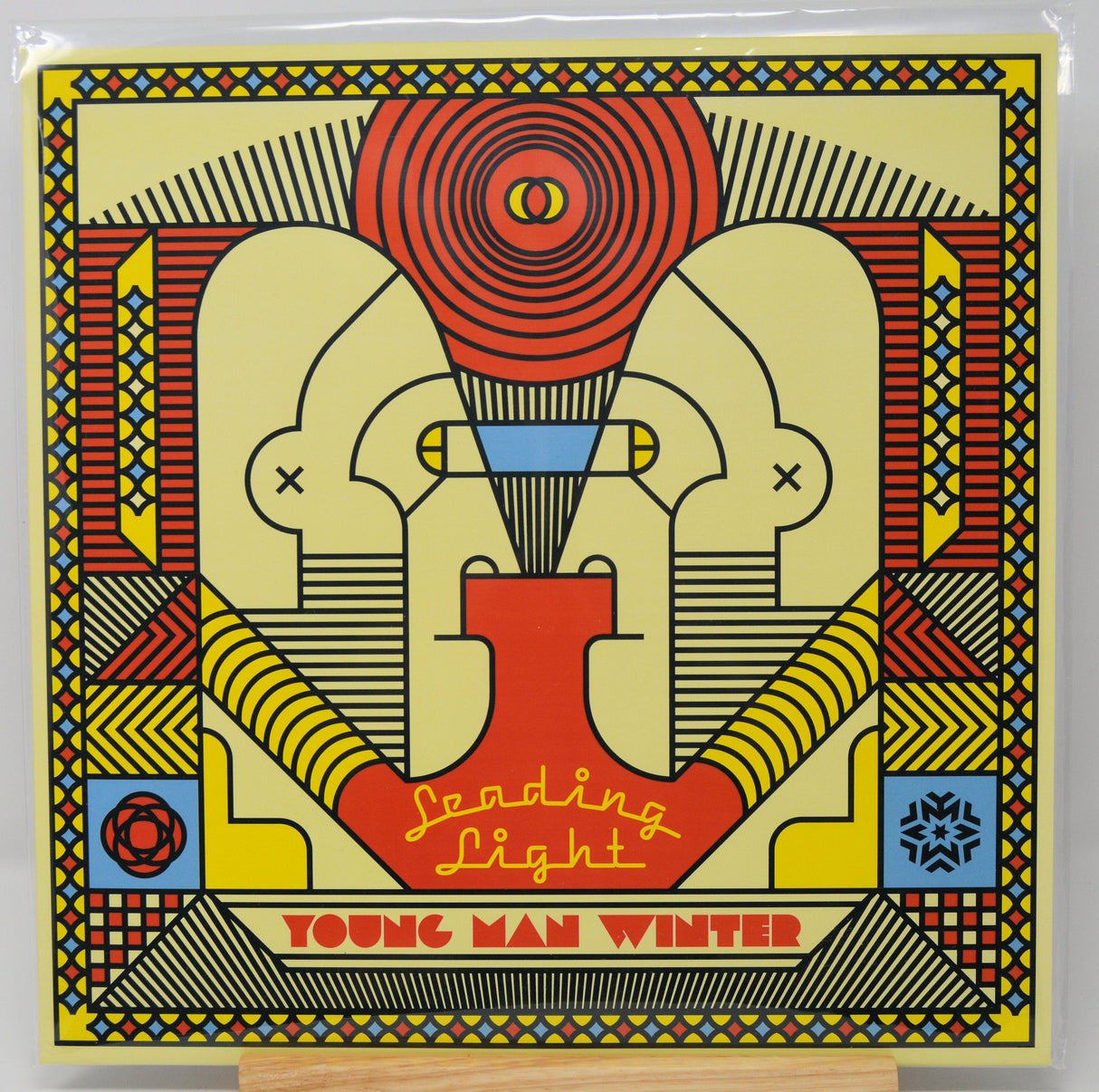 Front cover of Young Man Winter's Leading Light vinyl album featuring bold, colorful geometric artwork