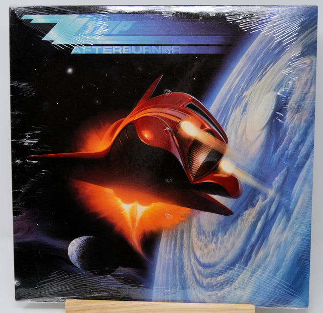 Vinyl record cover with a futuristic spaceship design and 'Interplanetary' text.