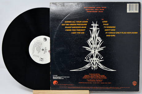 Vinyl record with its cover displaying tracklist on a white background