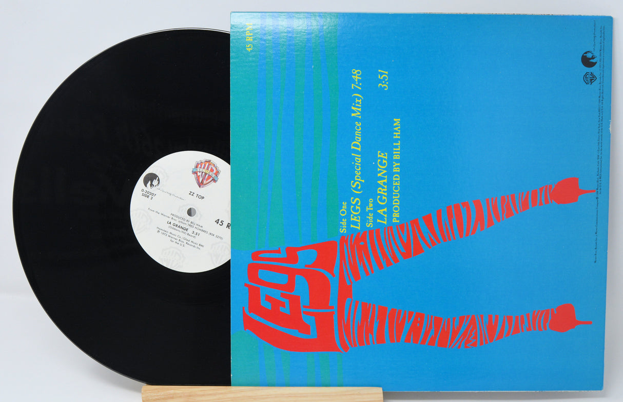 Vinyl record with a blue cover featuring red text on a white background