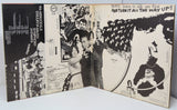Inside gatefold of vinyl record cover with black and white graphics and text.