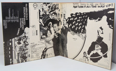 Inside gatefold of vinyl record cover with black and white graphics and text.