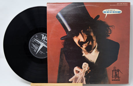 Vinyl record with cover art featuring Frank Zappa in a top hat and mustache.
