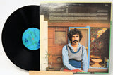 'Vinyl Record and Back Cover' Vinyl record with cover featuring Zappa in front of a cabin