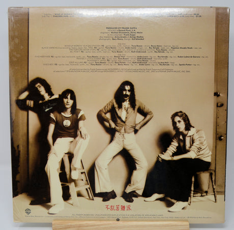 Album cover with a black and white photo of Frank Zappa and band members and production credits.
