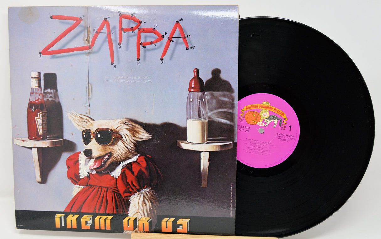 Vinyl record with cover featuring a dog in sunglasses and the word 'Zappa'.