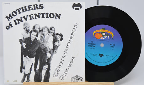 Vinyl record and cover for 'Mothers of Invention' album on a white background
