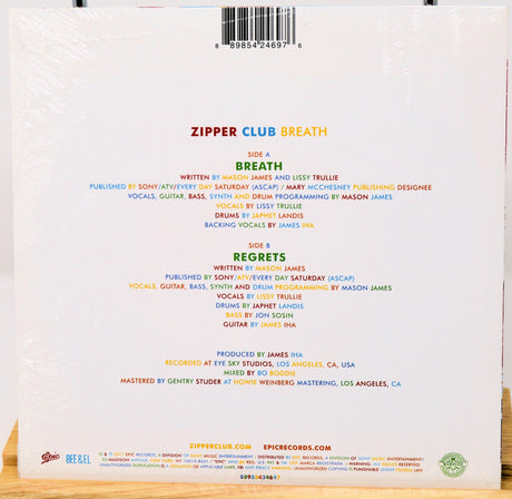 Back cover of a music album with tracklist and production credits on a white background