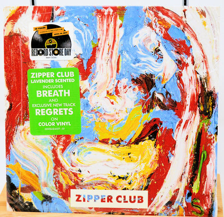 Colorful vinyl record packaging with 'Zipper Club' branding, colorful abstract art and text.