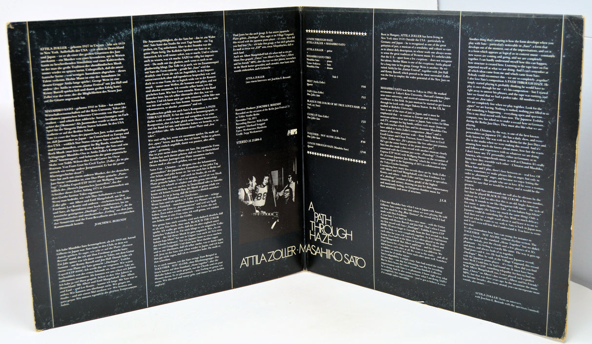 Inside gatefold with text and a central image on a white background