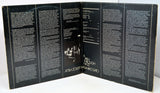 Inside gatefold with text and a central image on a white background