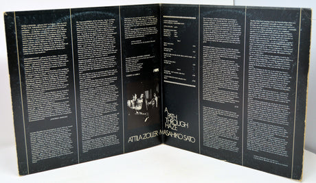 Inside gatefold with text and a central image on a white background