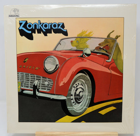 Album cover of 'Zonkaraz' with a red car and cartoonish animals on a beige background