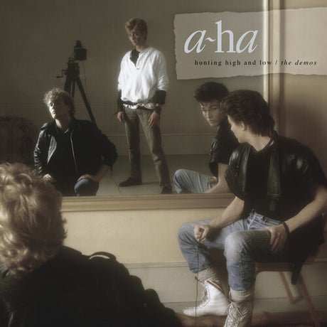 Album cover with a person sitting in front of a mirror, reflecting the 'a-ha' band members.