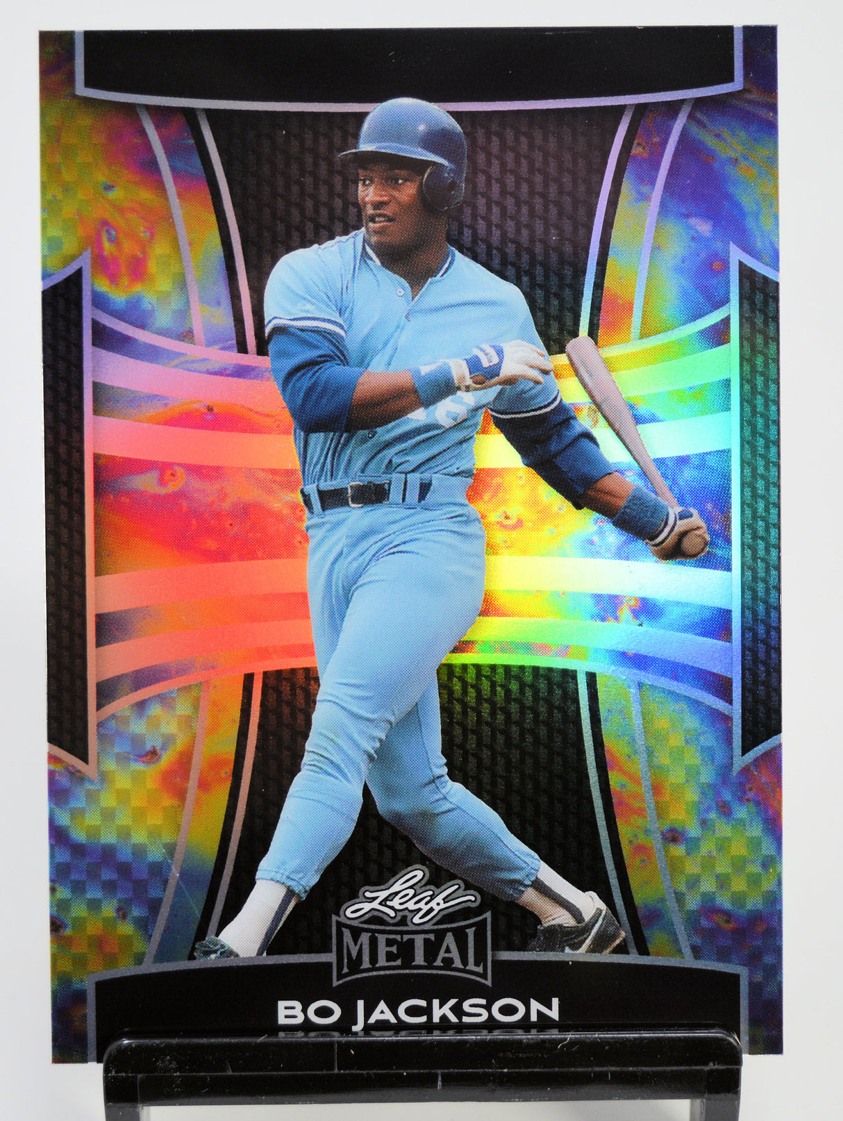 Baseball trading card of Bo Jackson in a light blue uniform with a colorful background