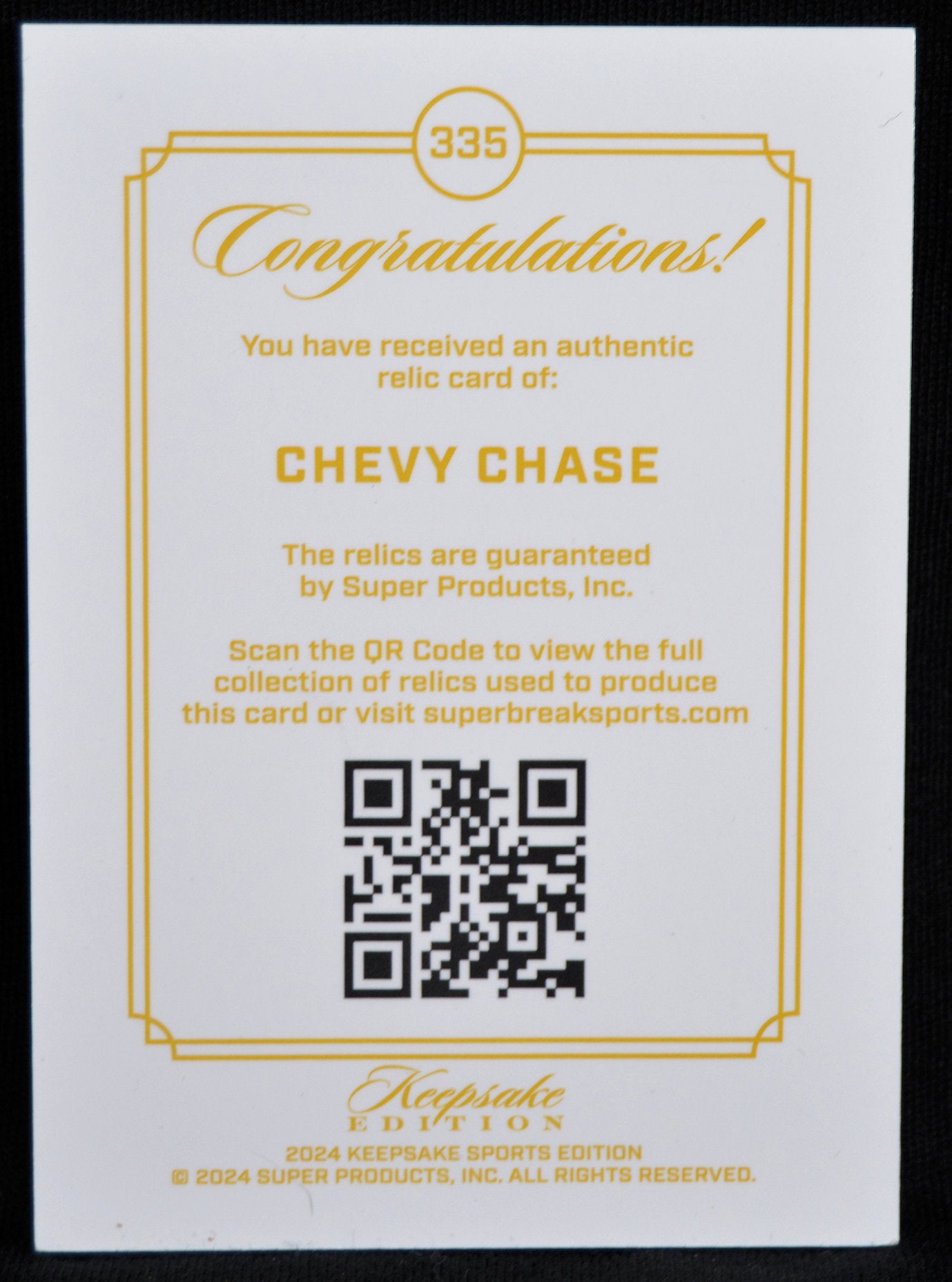 Authentic relic card of Chevy Chase with QR code on a white background