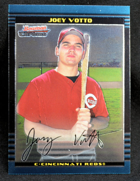 Baseball trading card of Joey Votto holding a bat on a field background. Bowman Chrome Draft Rookie Card.