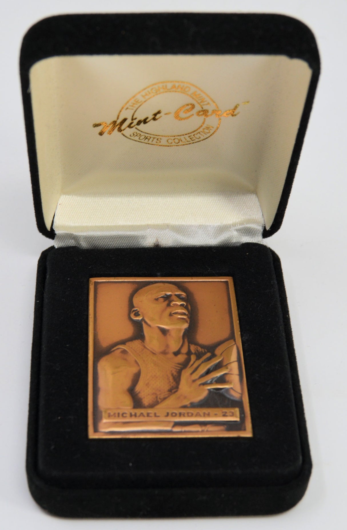 Michael Jordan bronze trading card in a display case.