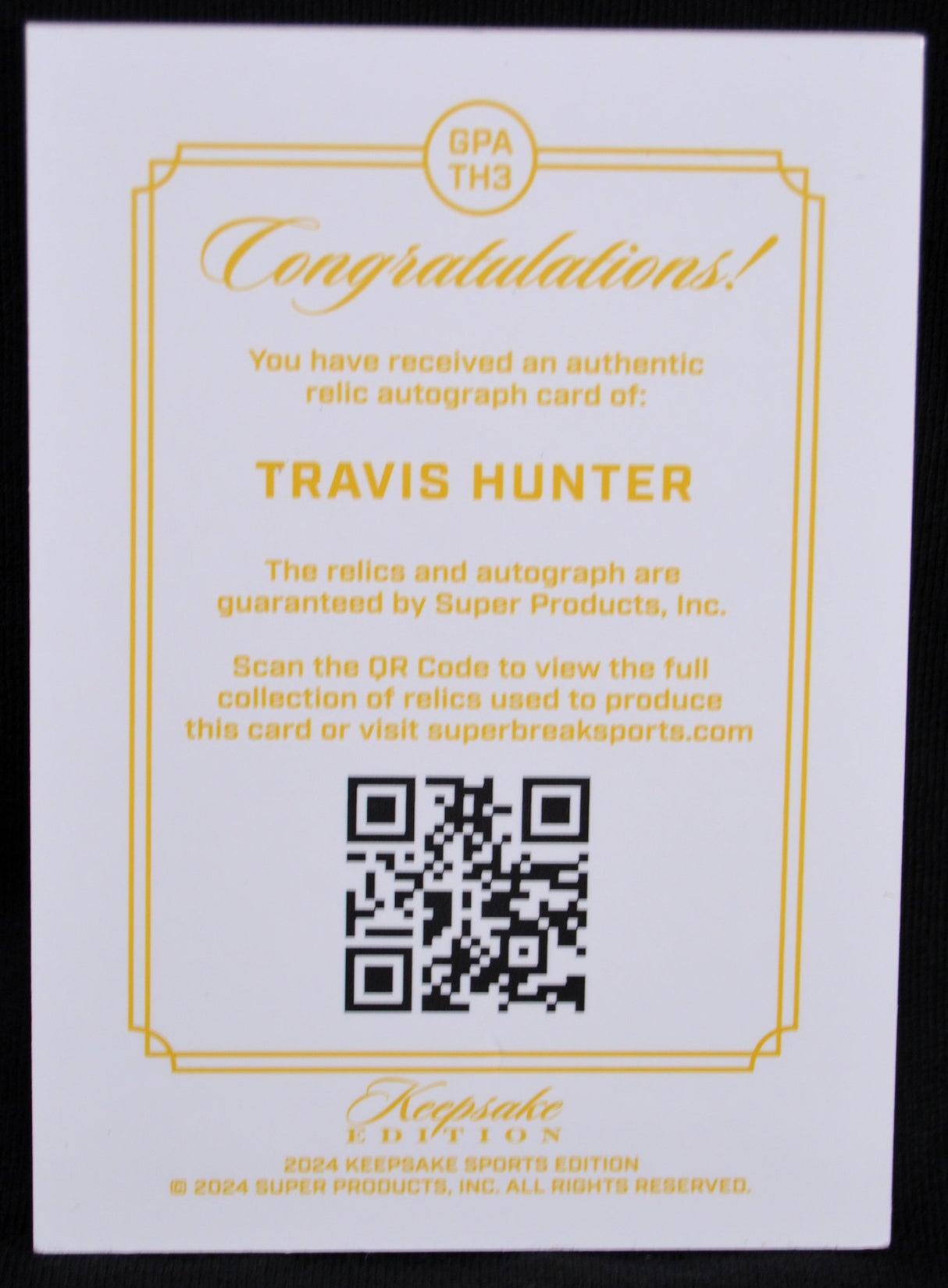 Authentic relic autograph card of Travis Hunter with QR code on a white background