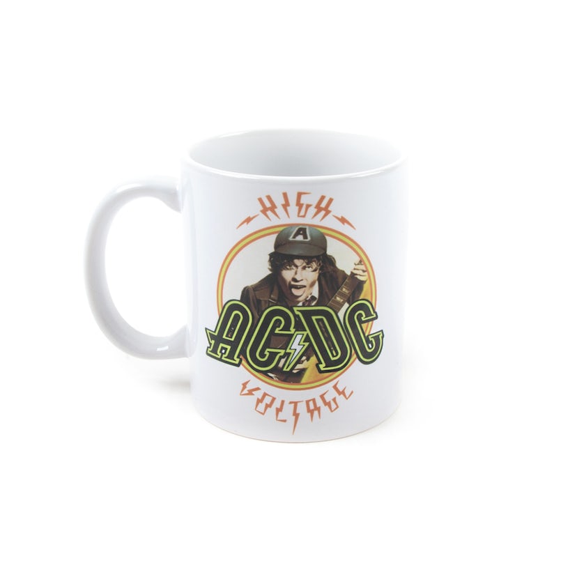 A white ceramic mug with a graphic design of AC/DC's 'High Voltage' logo and a character illustration in green and yellow tones.