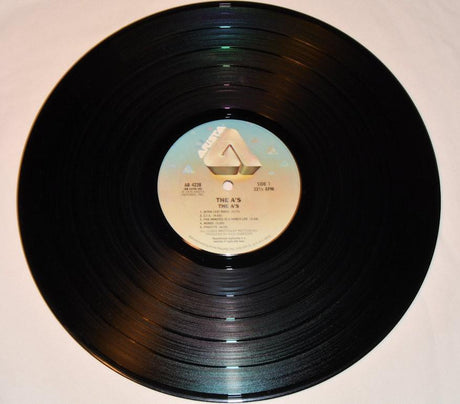 Album cover featuring a band with the title 'The A's' and a beach scene.