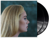 A vinyl record album cover featuring a profile picture of the artist Adele with the album title '30' above her name.