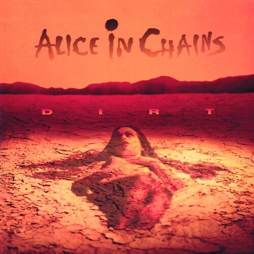 Album cover for Alice In Chains - Dirt featuring a reddish-toned image of a person lying down with a desert landscape in the background.
