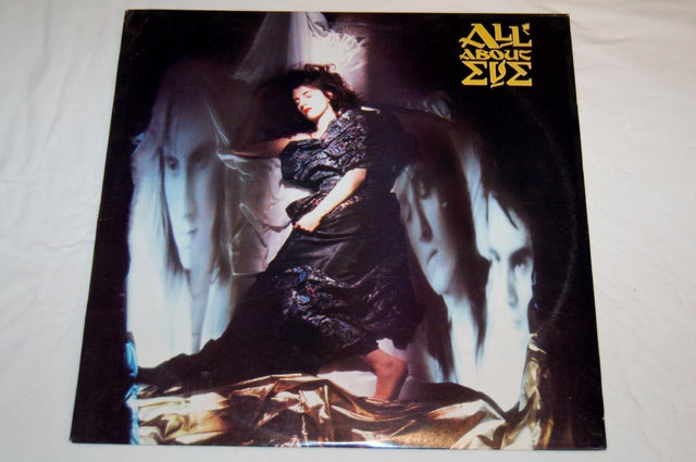 Vinyl record album cover featuring a monochrome image of a woman in an dramatic pose with flowing fabrics around her.
