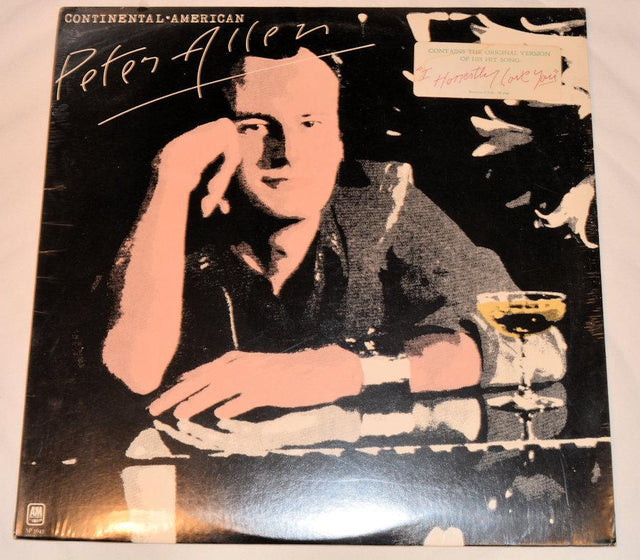 vinyl record cover featuring artwork of a man sitting at a table